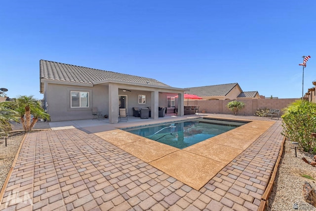 12590 E 48th Dr, Yuma, AZ 85367 - view of swimming pool with a patio area, a fenced backyard, a ceiling fan, and outdoor lounge area