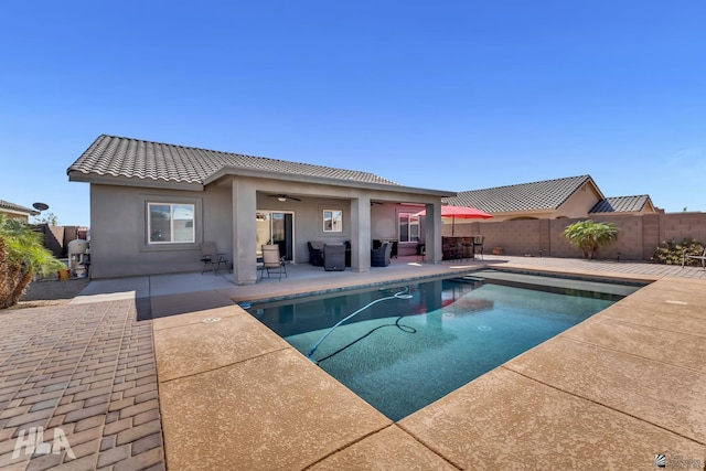 12590 E 48th Dr, Yuma, AZ 85367 - view of swimming pool featuring a fenced backyard, a patio area, and a ceiling fan