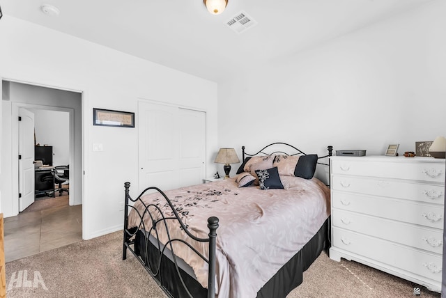 12590 E 48th Dr, Yuma, AZ 85367 - bedroom featuring a desk, a closet, light colored carpet, and baseboards
