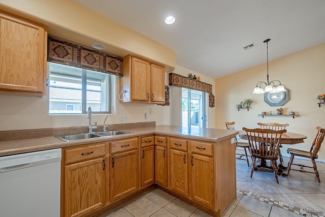 13743 E 45th Ln, Yuma, AZ 85367 - kitchen featuring visible vents, a peninsula, lofted ceiling, a sink, and dishwasher