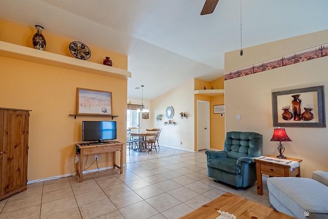 13743 E 45th Ln, Yuma, AZ 85367 - living room with light tile patterned floors, baseboards, ceiling fan, and vaulted ceiling