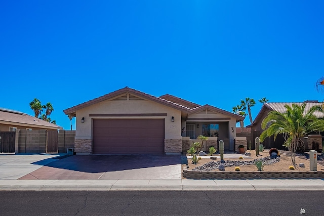 13743 E 45th Ln, Yuma, AZ 85367 - ranch-style home with a gate, a garage, fence, concrete driveway, and stucco siding