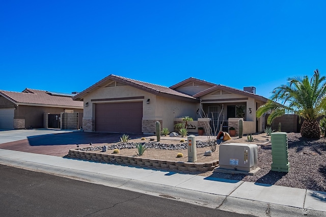 13743 E 45th Ln, Yuma, AZ 85367 - ranch-style home featuring a garage, stucco siding, driveway, and a tile roof