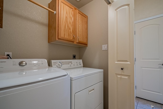 13743 E 45th Ln, Yuma, AZ 85367 - washroom featuring cabinet space, light tile patterned flooring, and washer and dryer