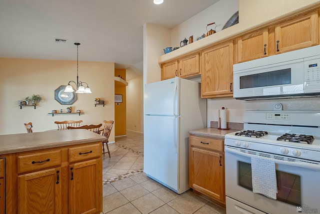 13743 E 45th Ln, Yuma, AZ 85367 - kitchen featuring visible vents, pendant lighting, light tile patterned flooring, white appliances, and a chandelier