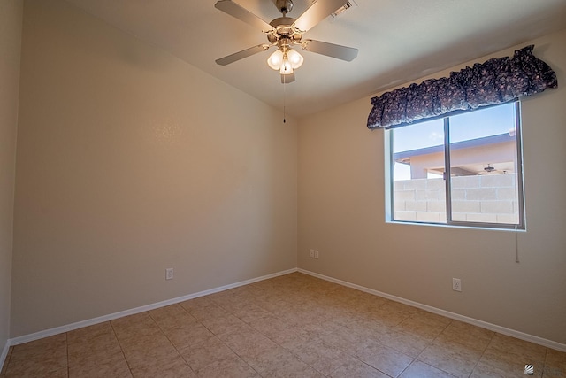 13743 E 45th Ln, Yuma, AZ 85367 - empty room featuring baseboards, ceiling fan, vaulted ceiling, and light tile patterned flooring