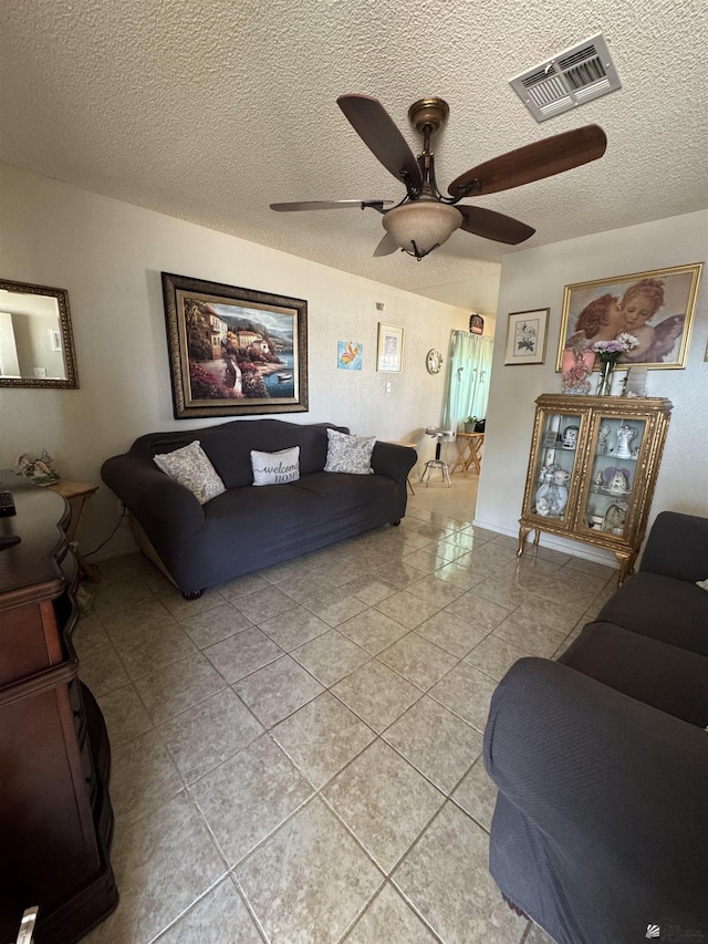778 W Ramona St, Somerton, AZ 85350 - living room with visible vents, a ceiling fan, a textured ceiling, and light tile patterned flooring