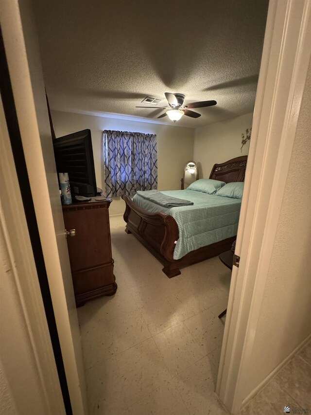 778 W Ramona St, Somerton, AZ 85350 - bedroom with visible vents, a textured ceiling, ceiling fan, and tile patterned floors