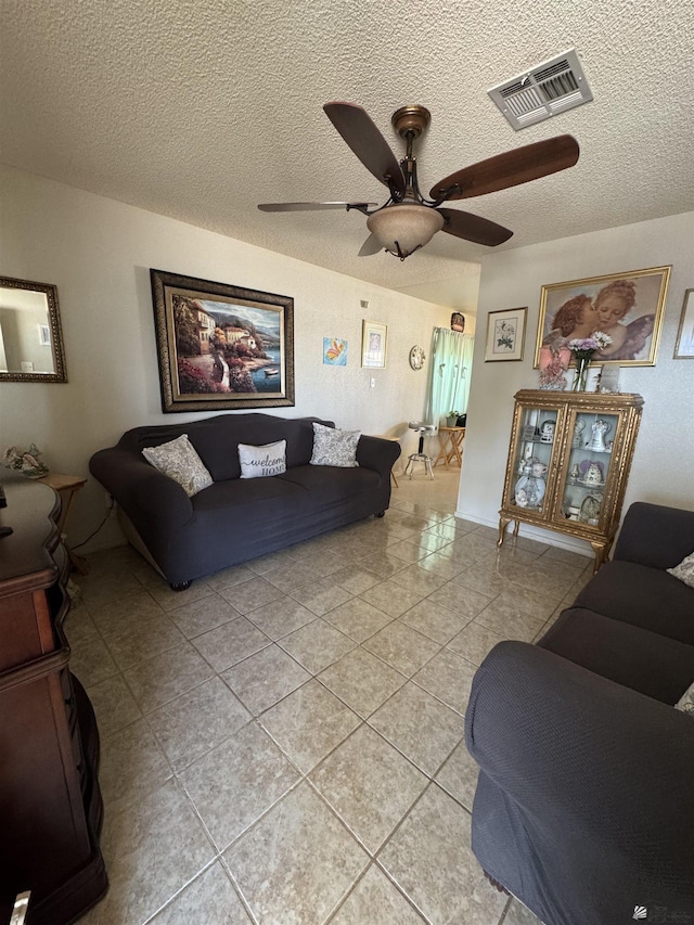 778 W Ramona St, Somerton, AZ 85350 - living room featuring visible vents, a textured ceiling, ceiling fan, and light tile patterned flooring