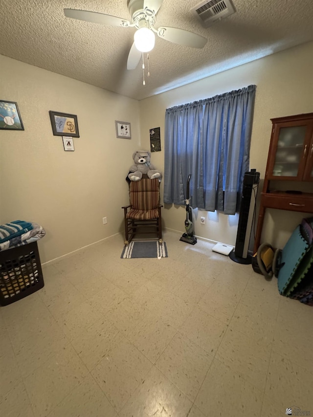778 W Ramona St, Somerton, AZ 85350 - interior space with a ceiling fan, a textured ceiling, visible vents, tile patterned floors, and baseboards