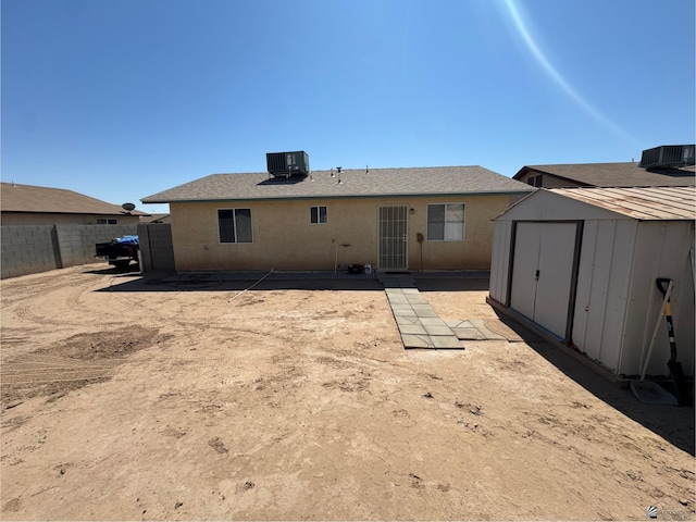 778 W Ramona St, Somerton, AZ 85350 - rear view of property featuring a storage shed, fence, an outdoor structure, and stucco siding