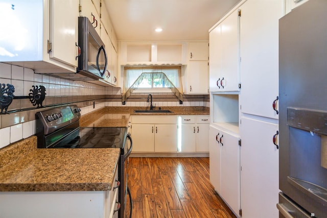 500 S 7th Ave, Yuma, AZ 85364 - kitchen with black appliances, dark wood-type flooring, white cabinetry, and recessed lighting