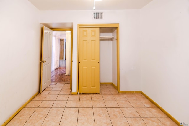500 S 7th Ave, Yuma, AZ 85364 - unfurnished bedroom featuring light tile patterned floors and a closet