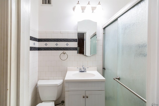 500 S 7th Ave, Yuma, AZ 85364 - bathroom with tile walls, vanity, and a shower with shower door