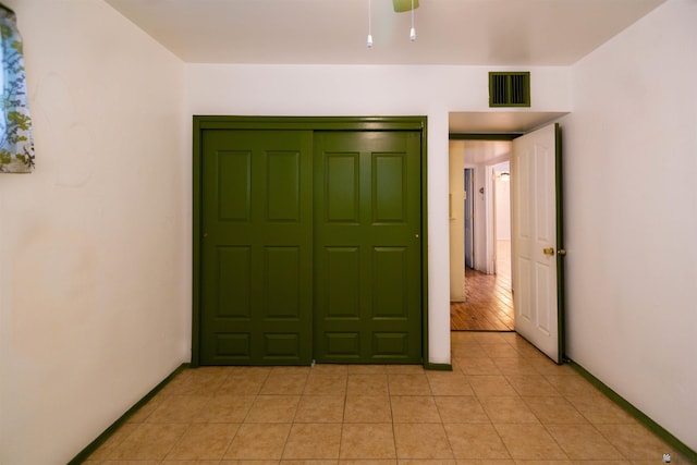500 S 7th Ave, Yuma, AZ 85364 - unfurnished bedroom with light tile patterned floors and baseboards
