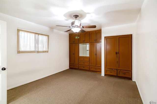 500 S 7th Ave, Yuma, AZ 85364 - unfurnished bedroom featuring carpet flooring and ceiling fan
