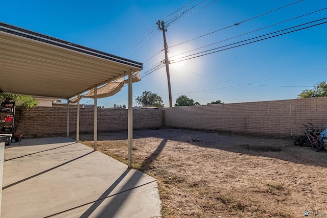view of yard with a fenced backyard and a patio area