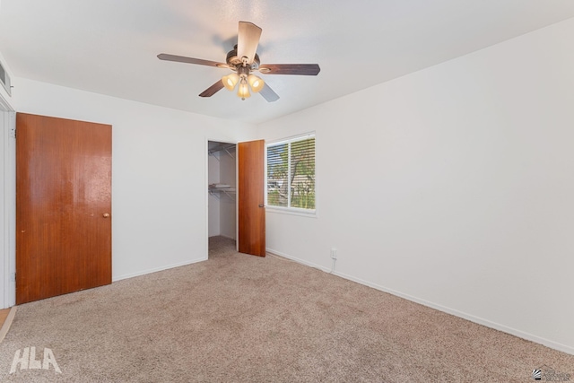 324 S 19th Ave, Yuma, AZ 85364 - unfurnished bedroom with carpet flooring, a closet, baseboards, and ceiling fan