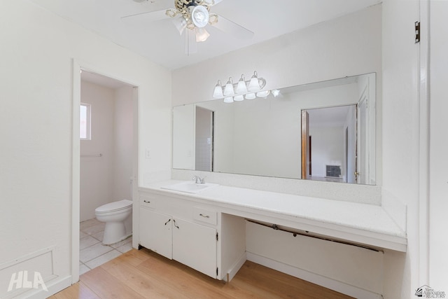 324 S 19th Ave, Yuma, AZ 85364 - bathroom featuring toilet, wood finished floors, vanity, and ceiling fan