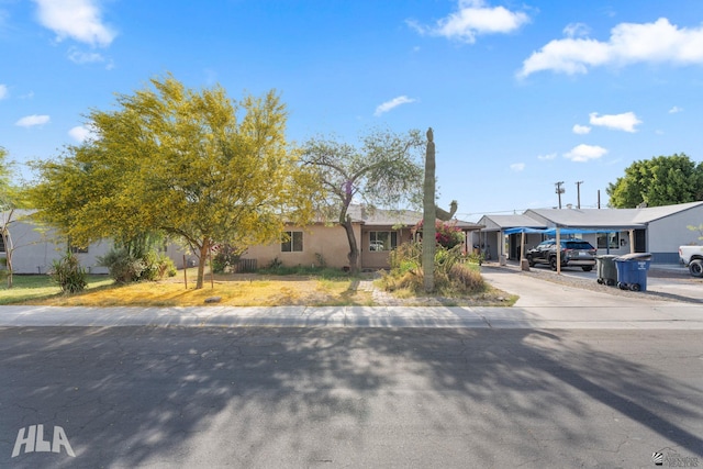 324 S 19th Ave, Yuma, AZ 85364 - ranch-style house with concrete driveway, stucco siding, and a residential view