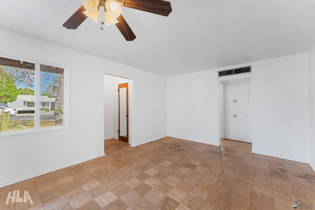 324 S 19th Ave, Yuma, AZ 85364 - unfurnished room featuring visible vents, baseboards, and a ceiling fan