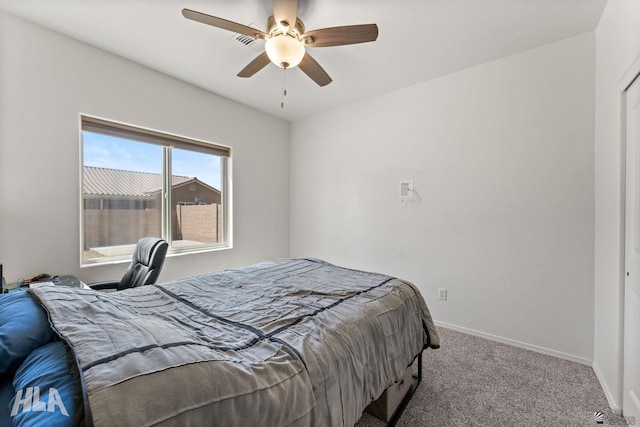 bedroom featuring carpet floors, a ceiling fan, and baseboards