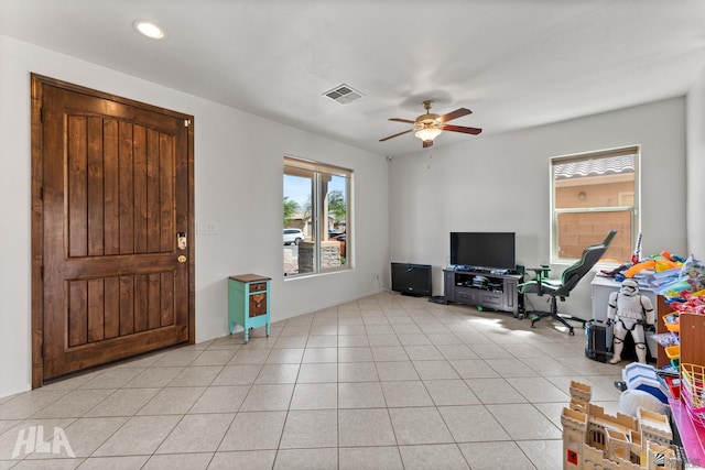 foyer entrance with visible vents, light tile patterned flooring, baseboards, recessed lighting, and a ceiling fan