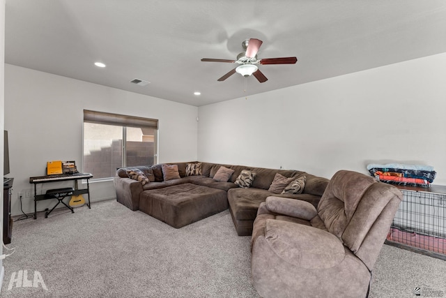 living room featuring visible vents, a ceiling fan, recessed lighting, and light carpet