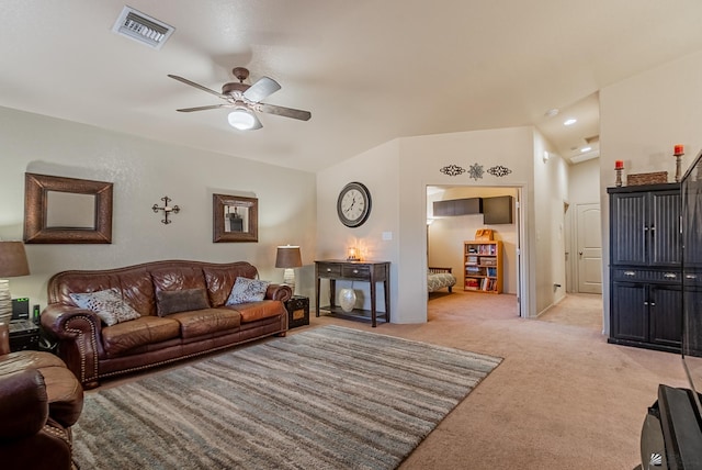 living room with light colored carpet, a ceiling fan, and visible vents