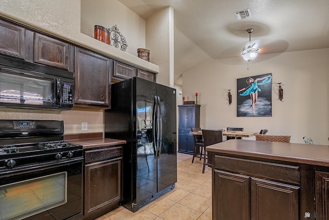 kitchen with dark brown cabinetry, a ceiling fan, visible vents, black appliances, and lofted ceiling