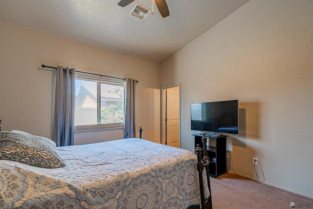 carpeted bedroom with baseboards, visible vents, ceiling fan, and lofted ceiling