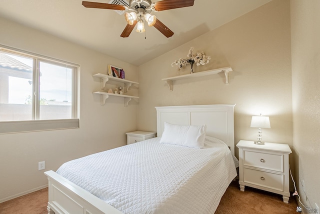 bedroom with baseboards, vaulted ceiling, ceiling fan, and carpet