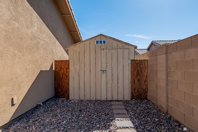 view of shed with fence