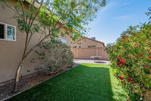 view of yard featuring a patio area and fence