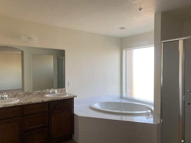 3806 S Sol Dr, Yuma, AZ 85365 - bathroom with double vanity, a sink, a bath, and a stall shower