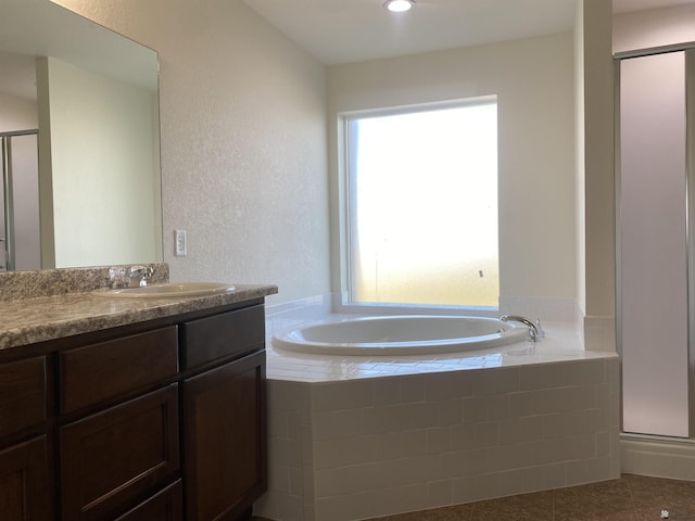 3806 S Sol Dr, Yuma, AZ 85365 - full bathroom featuring vanity, a garden tub, a stall shower, and tile patterned floors