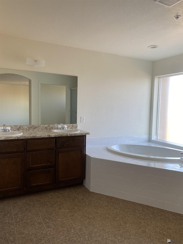 3806 S Sol Dr, Yuma, AZ 85365 - bathroom featuring a sink, a garden tub, double vanity, and visible vents