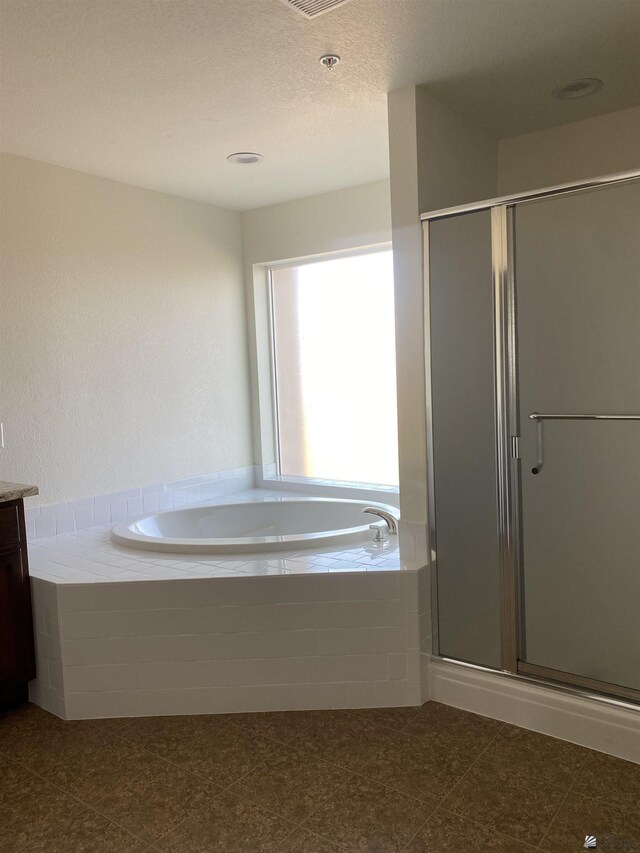 3806 S Sol Dr, Yuma, AZ 85365 - full bathroom with vanity, a bath, visible vents, and a shower stall
