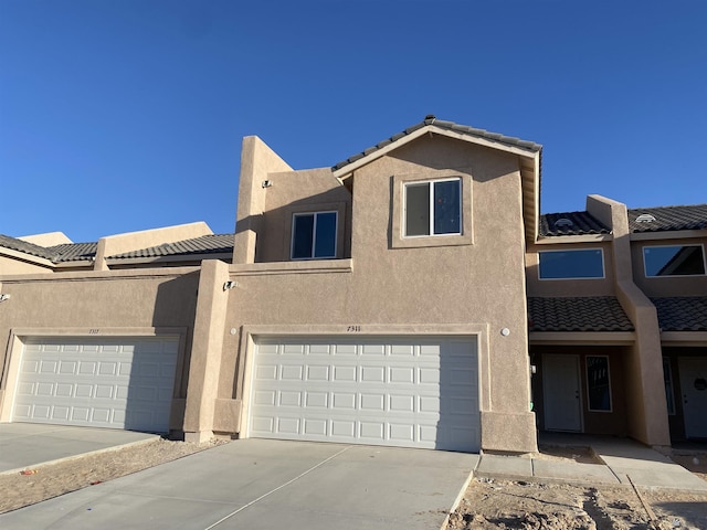 3806 S Sol Dr, Yuma, AZ 85365 - townhome / multi-family property featuring a tiled roof, concrete driveway, and stucco siding