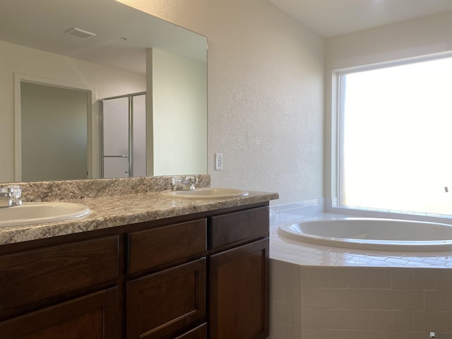 3806 S Sol Dr, Yuma, AZ 85365 - bathroom with a sink, a textured wall, and visible vents