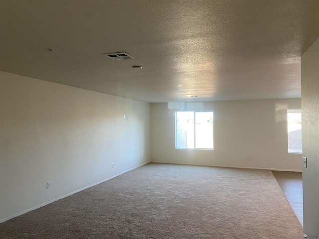 3806 S Sol Dr, Yuma, AZ 85365 - carpeted empty room with a textured ceiling, baseboards, and visible vents