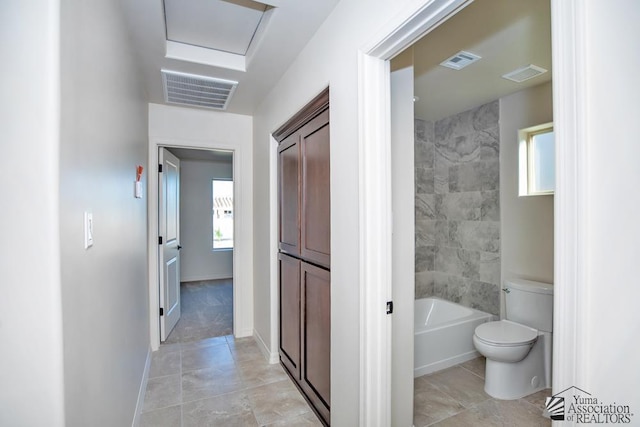 12634 E 51st Pl, Yuma, AZ 85367 - hall featuring healthy amount of natural light, light tile patterned floors, and baseboards
