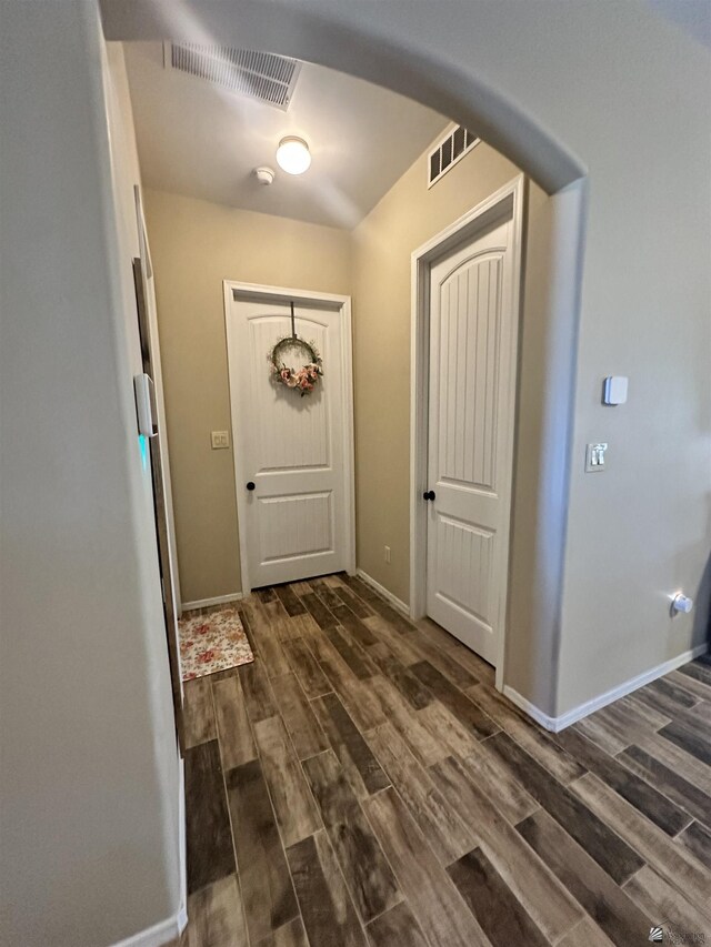 7955 E 37th St, Yuma, AZ 85365 - doorway to outside featuring dark wood finished floors and baseboards
