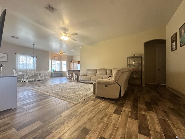 7955 E 37th St, Yuma, AZ 85365 - living area featuring ceiling fan, dark wood finished floors, and arched walkways