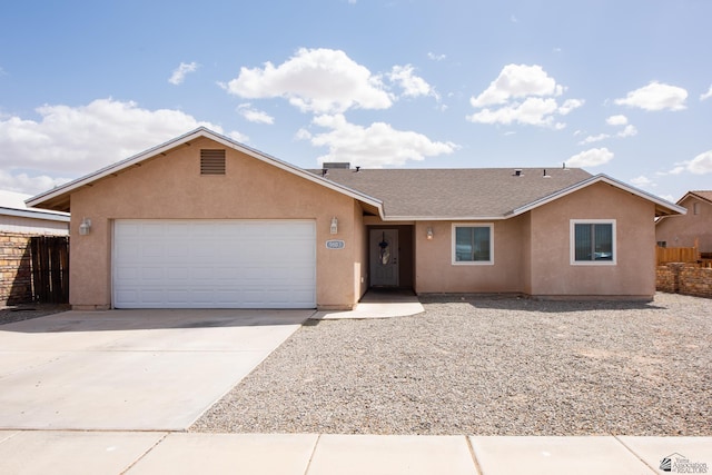 ranch-style home featuring stucco siding, fence, and a garage