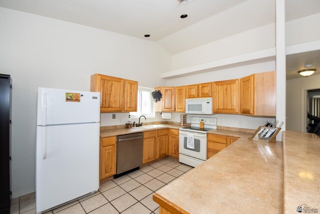 9603 E 36th Pl, Yuma, AZ 85365 - kitchen with white appliances, high vaulted ceiling, light tile patterned floors, and light countertops