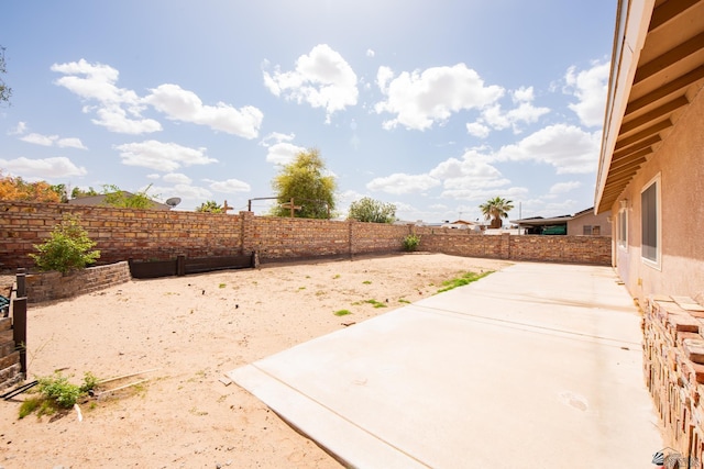 view of yard featuring a patio and a fenced backyard