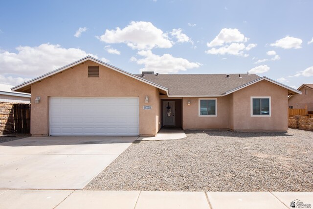 9603 E 36th Pl, Yuma, AZ 85365 - ranch-style home with an attached garage, stucco siding, concrete driveway, and roof with shingles
