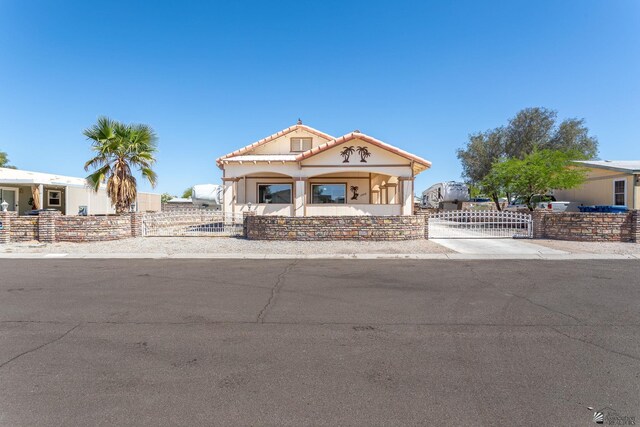 12656 E 45th St, Yuma, AZ 85367 - view of front facade featuring a fenced front yard, a tile roof, and stucco siding