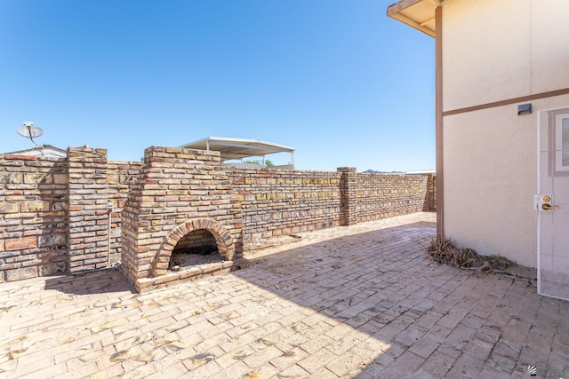 view of patio / terrace featuring fence
